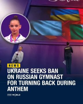 Бандеровские ублюдки из федерации гимнастики Украины призвали дисквалифицировать российскую спортсменку, которая повернулась спиной к флагу Украины, когда заиграл гимн этого несостоявшего государства